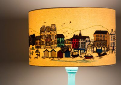 'South Coast Living' one off- embroidered lampshade This design is all based on Worthing seafront. I did some sketching of some of our town's buildings and mixed them all in to create this scene.