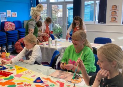 Participants of the Artful Workshops painting pieces for the jubilee community art project