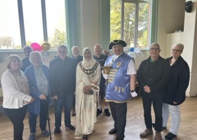 A photograph of the Mayor, the town crier and participants from the King's Coronation Celebration