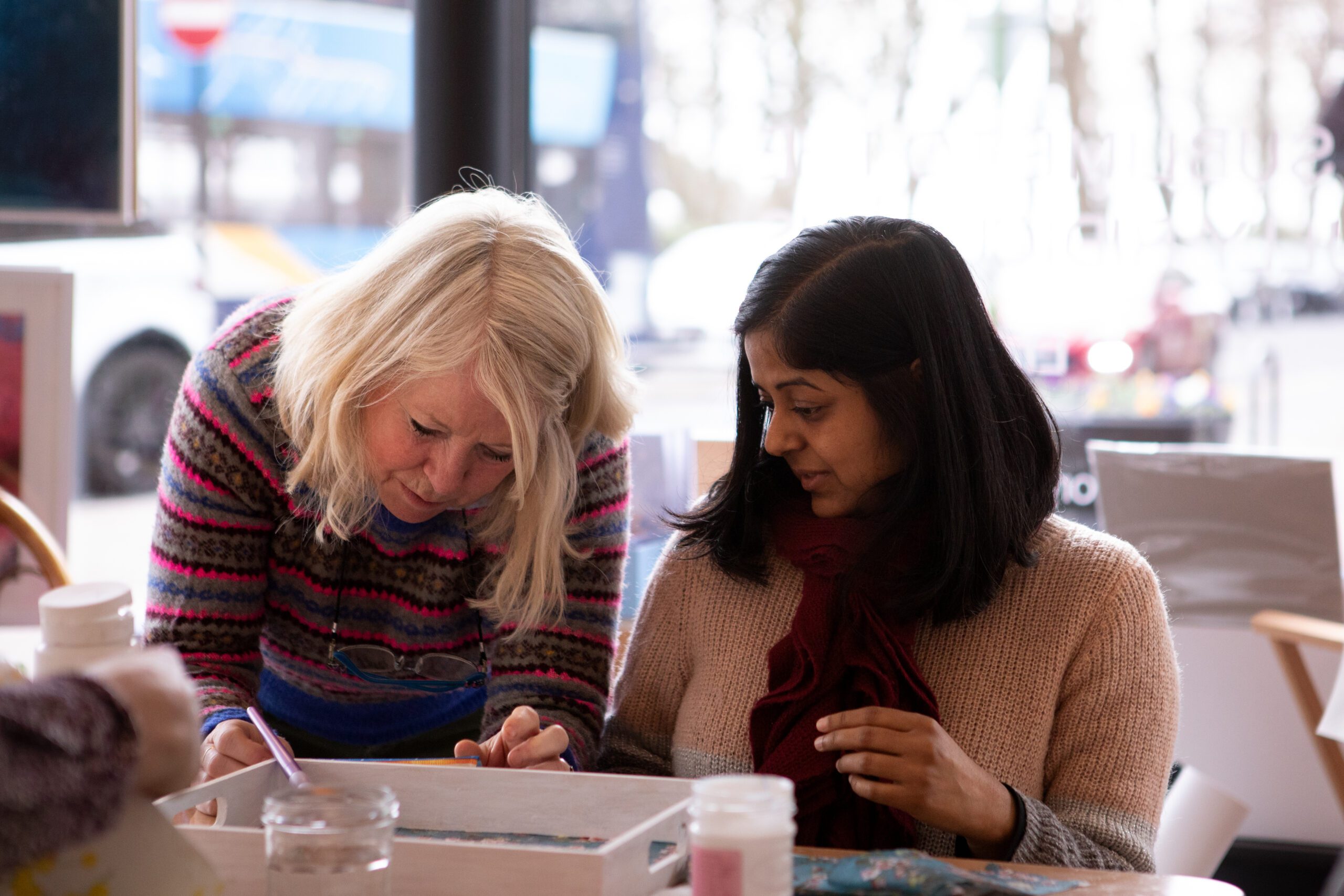 A photograph of Liz English and a participant during one of her workshops